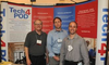 Tech4POD team members in front of a display at the GCMAS meeting
