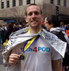 John Jameson holds his medal after completing the 115th Boston Marathon