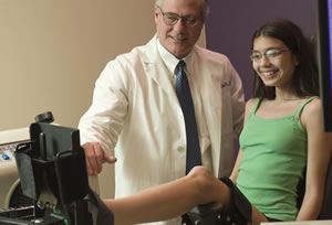 Dr. Gerald Harris with Patient Dr. Harris with a patient using a lower leg device.
