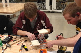 Two students work on the project